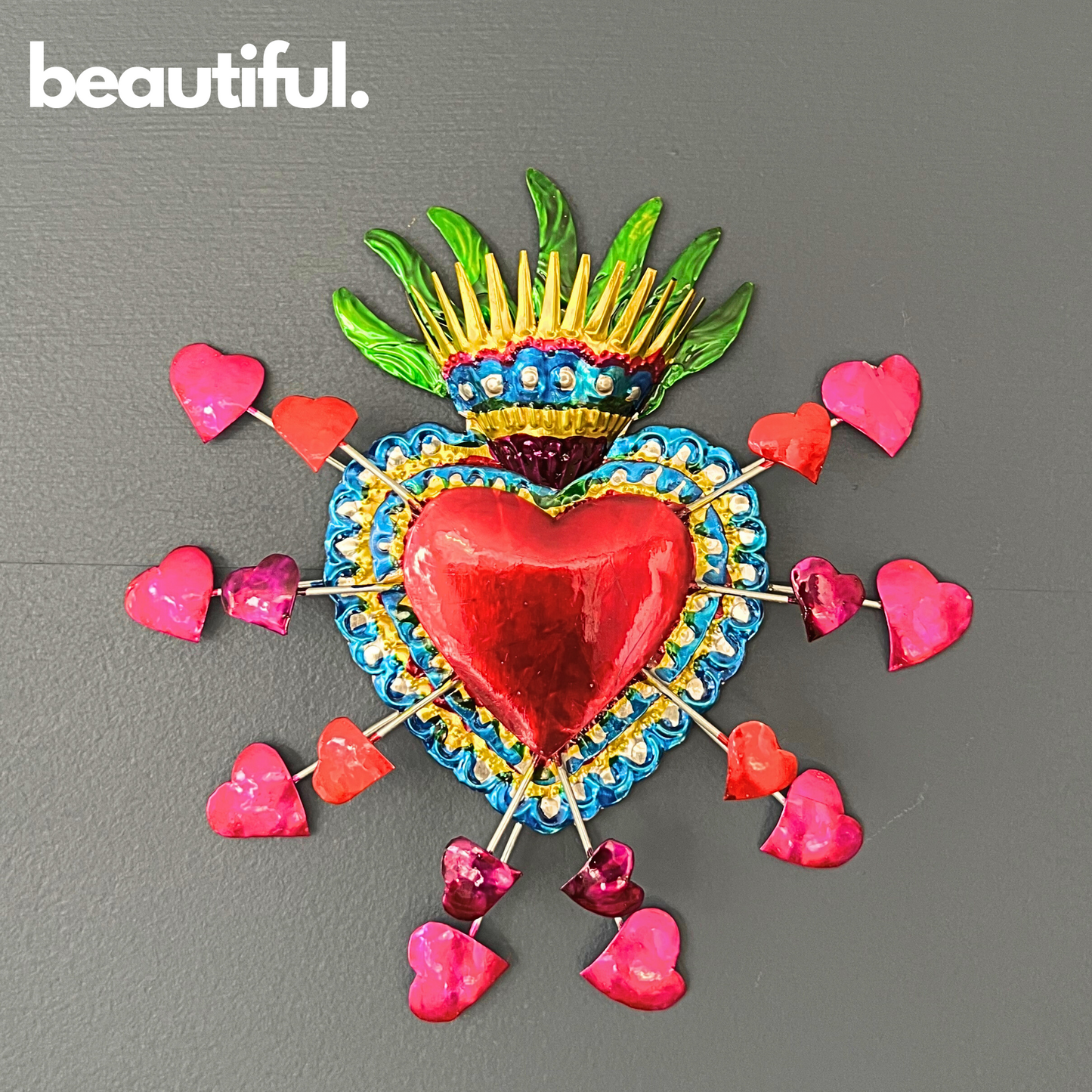 Colorful, hand-painted Embossed Tin Heart Milagro, a symbol of love and luck, easy to hang as vibrant Mexican Folk Art decor.