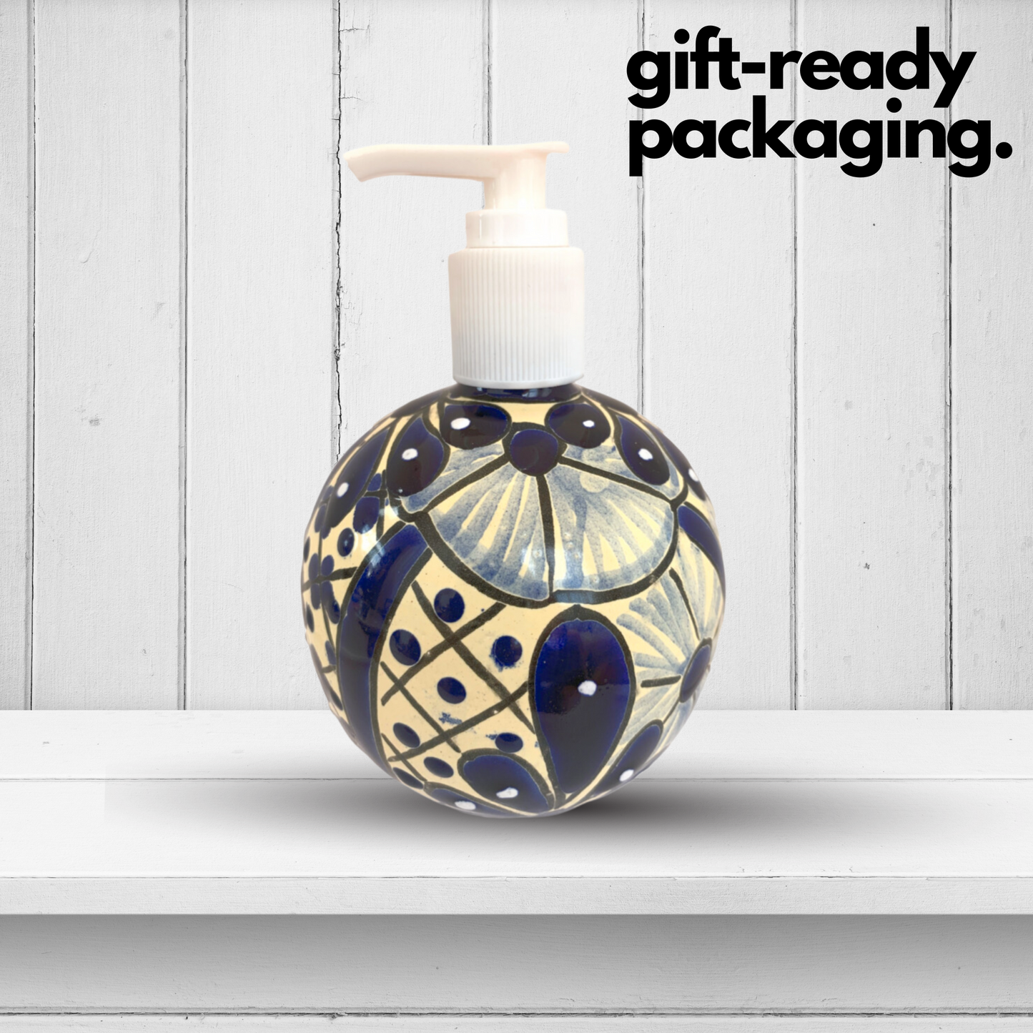 A spherical soap dispenser, hand-painted in blue and white Talavera design, adding a vibrant touch to any kitchen or bathroom.