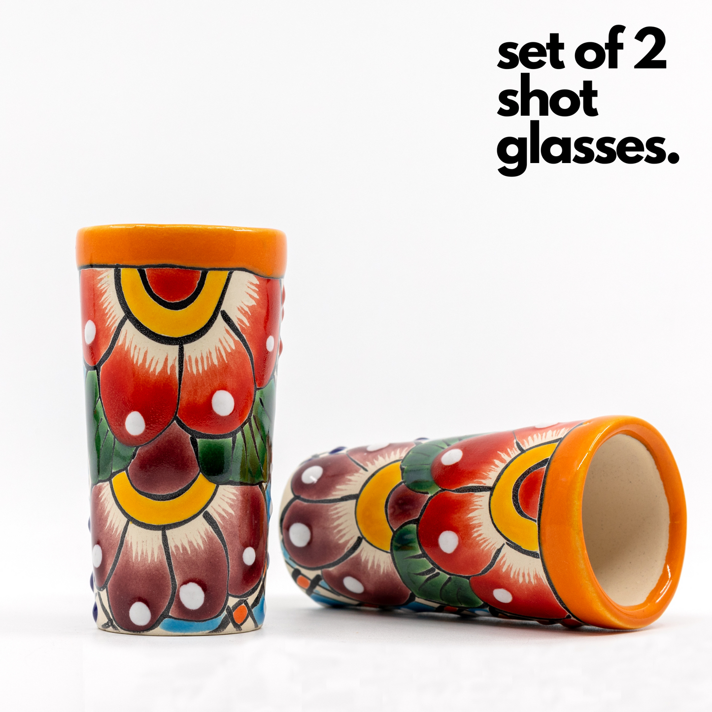 Set of four colorful hand-painted Mexican shot glasses, perfect for tequila or mezcal.