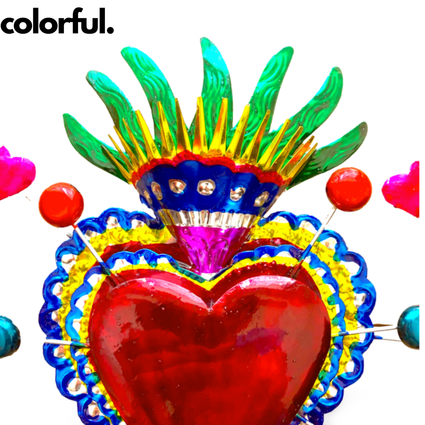 Vibrant, handcrafted Embossed Tin Heart Milagro wall decor, a unique piece of Mexican folk art, adding color and charm to any space.