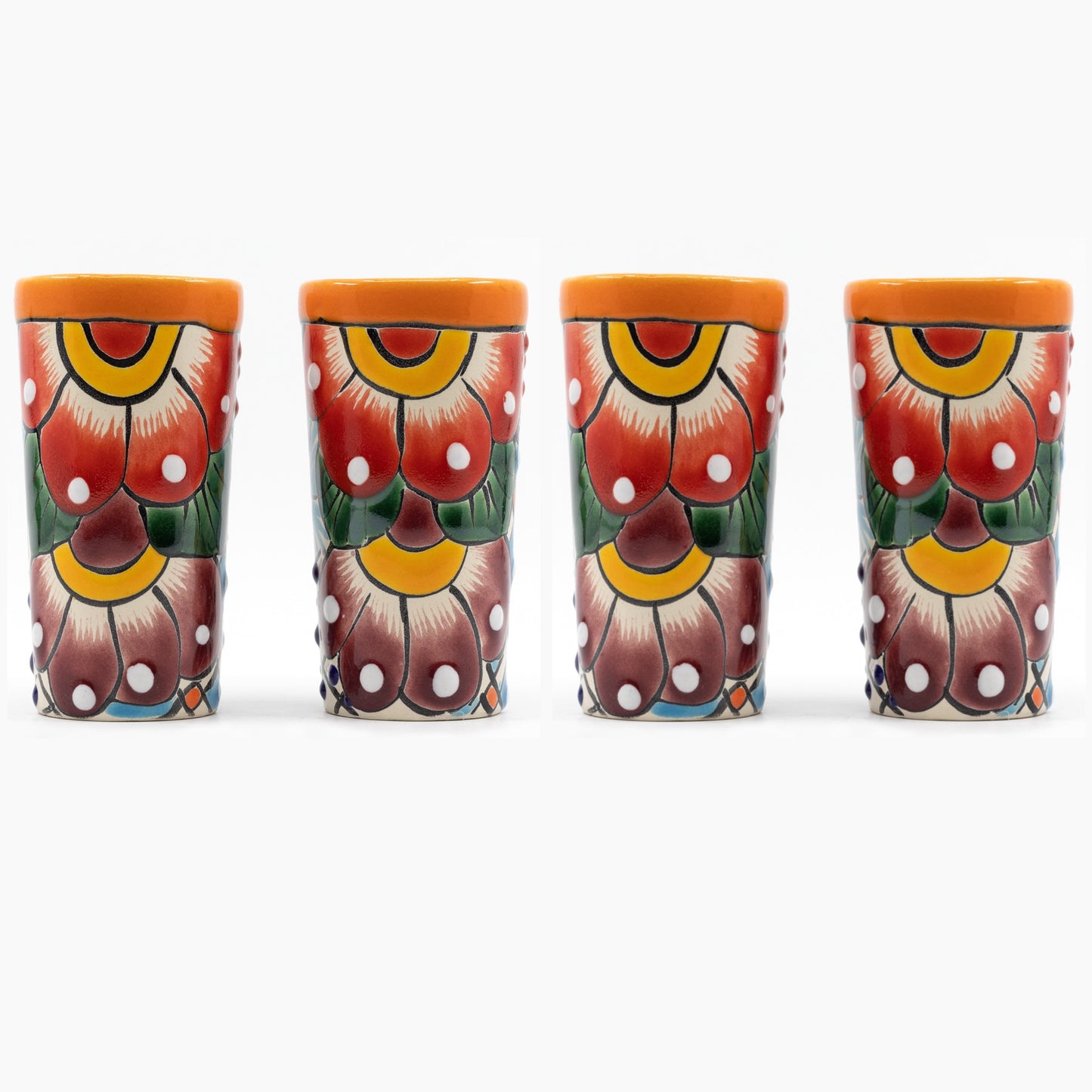 Set of four colorful hand-painted Mexican shot glasses, perfect for tequila or mezcal.
