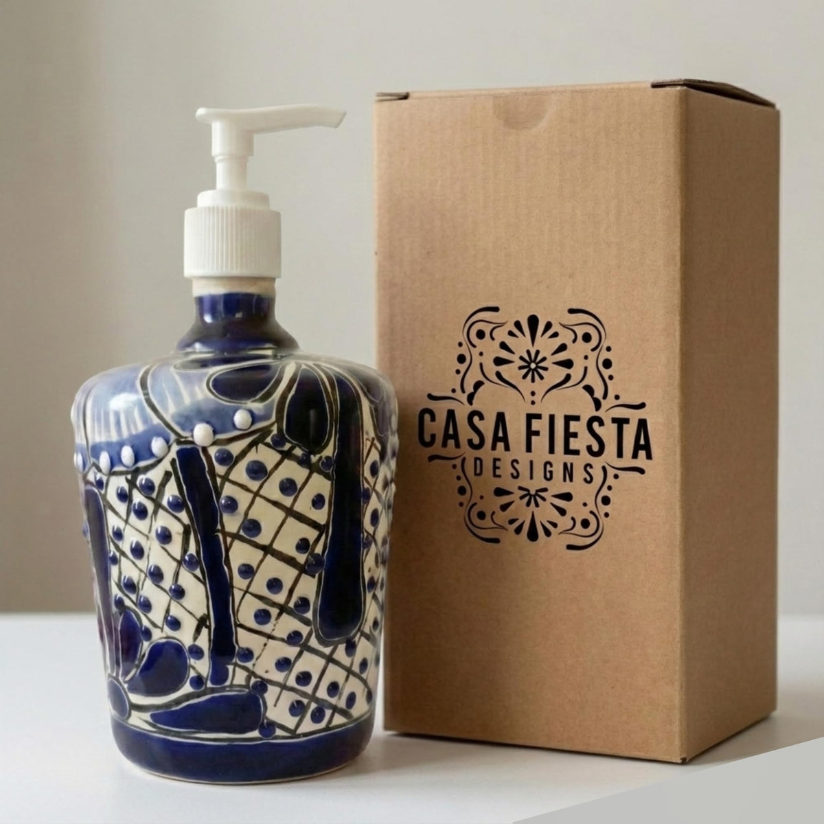 Blue and white soap dispenser next to its Casa Fiesta box