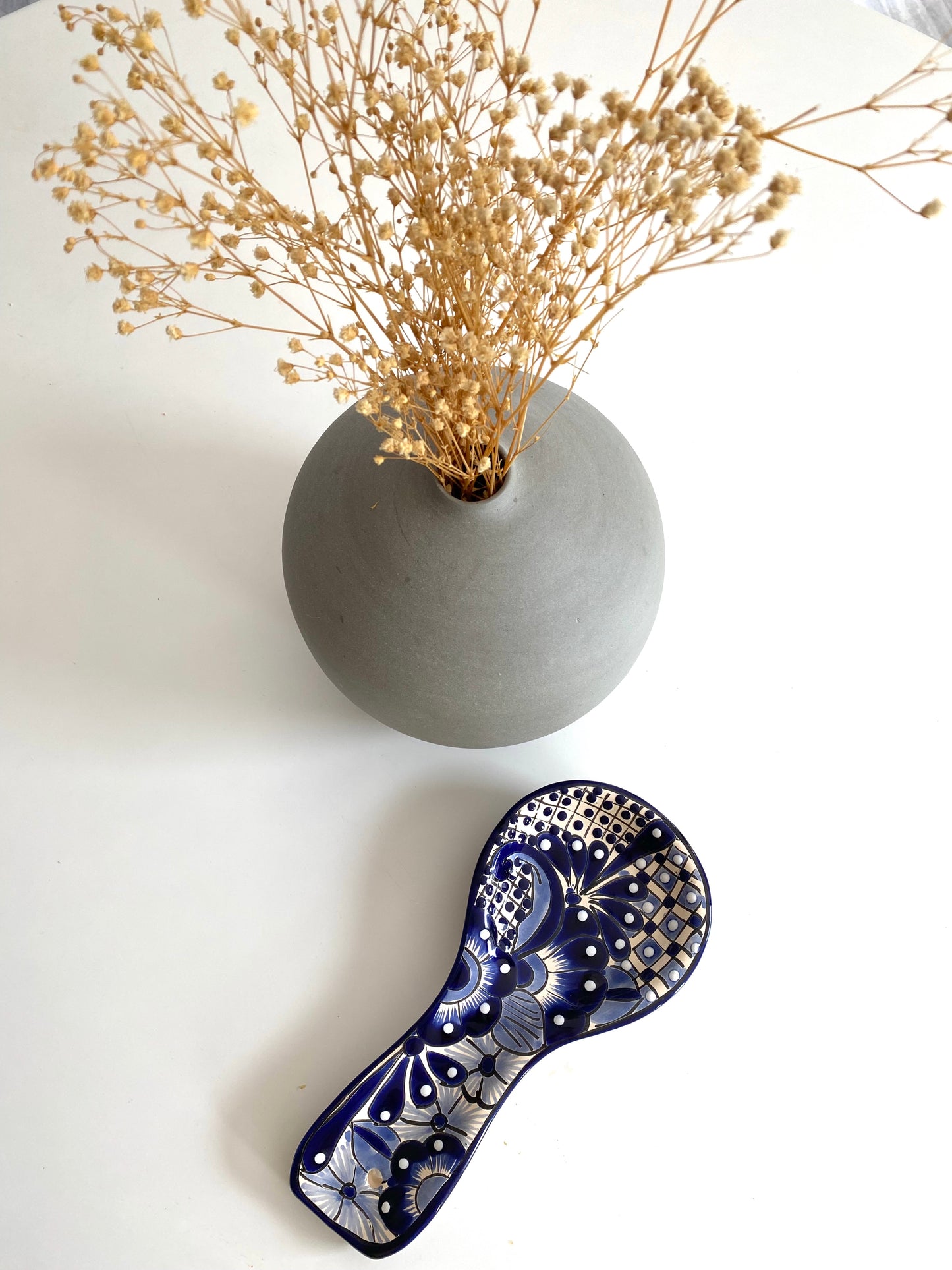 Charming blue & white Mexican handmade spoon rest, featuring handpainted folk art, made in Mexico as a unique porta cucharas spoon holder