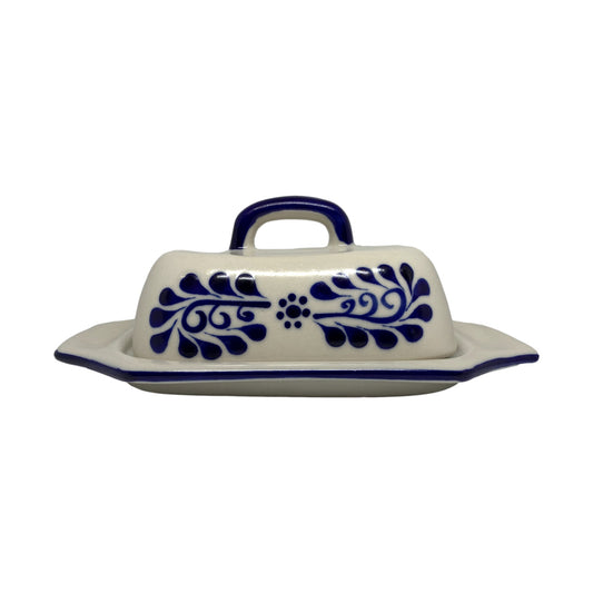 White Talavera-style butter dish with blue handle, front view
