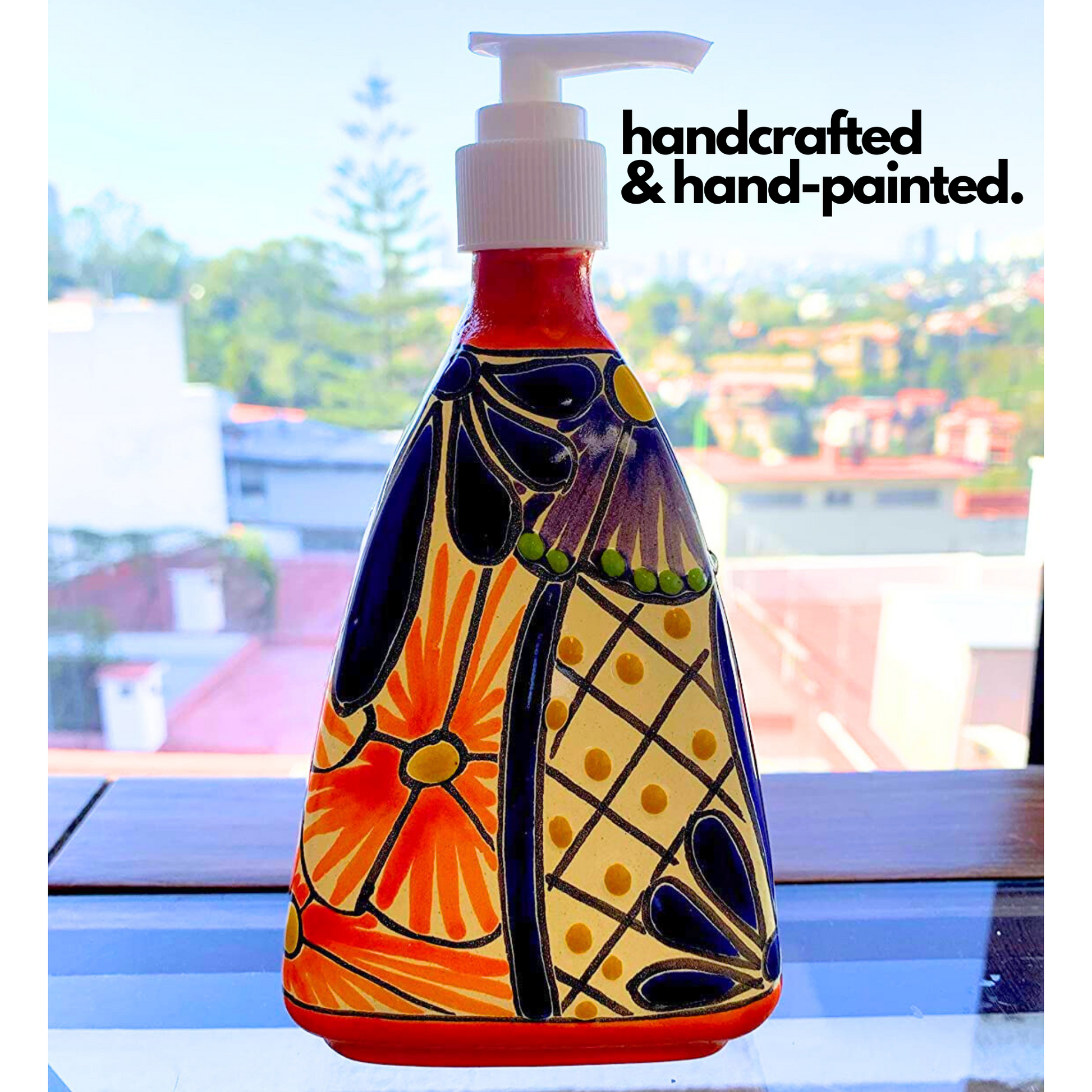 lifestyle photo of Pyramid-shaped Ceramic Soap Dispenser, hand-painted by Mexican artisans, perfect for adding a vibrant touch to kitchen or bathroom decor.