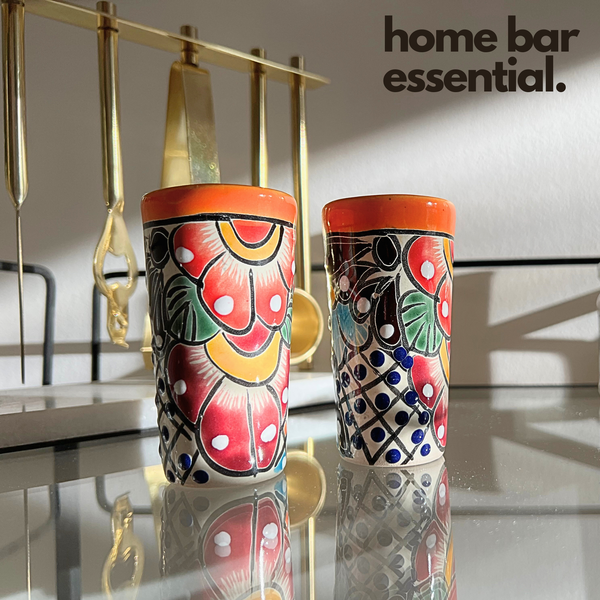Set of four colorful hand-painted Mexican shot glasses, perfect for tequila or mezcal.