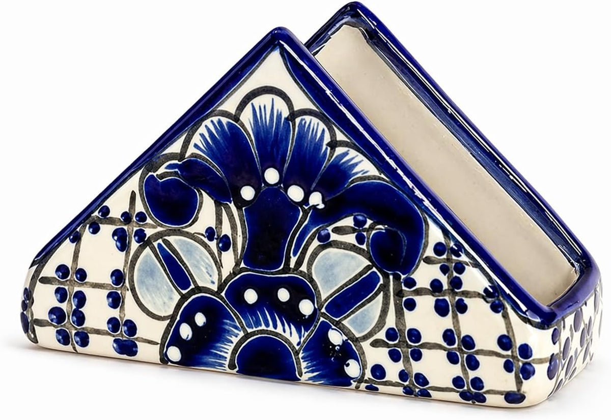 Blue and white Talavera-style ceramic napkin holder, hand-painted in Mexico — angled view showing the open slot