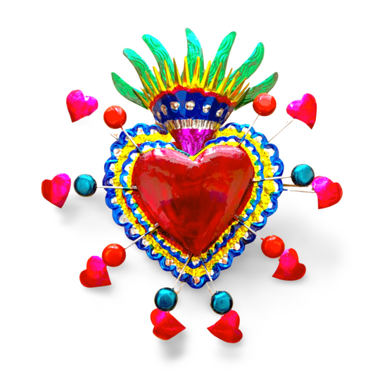 Vibrant, handcrafted Embossed Tin Heart Milagro wall decor, a unique piece of Mexican folk art, adding color and charm to any space.