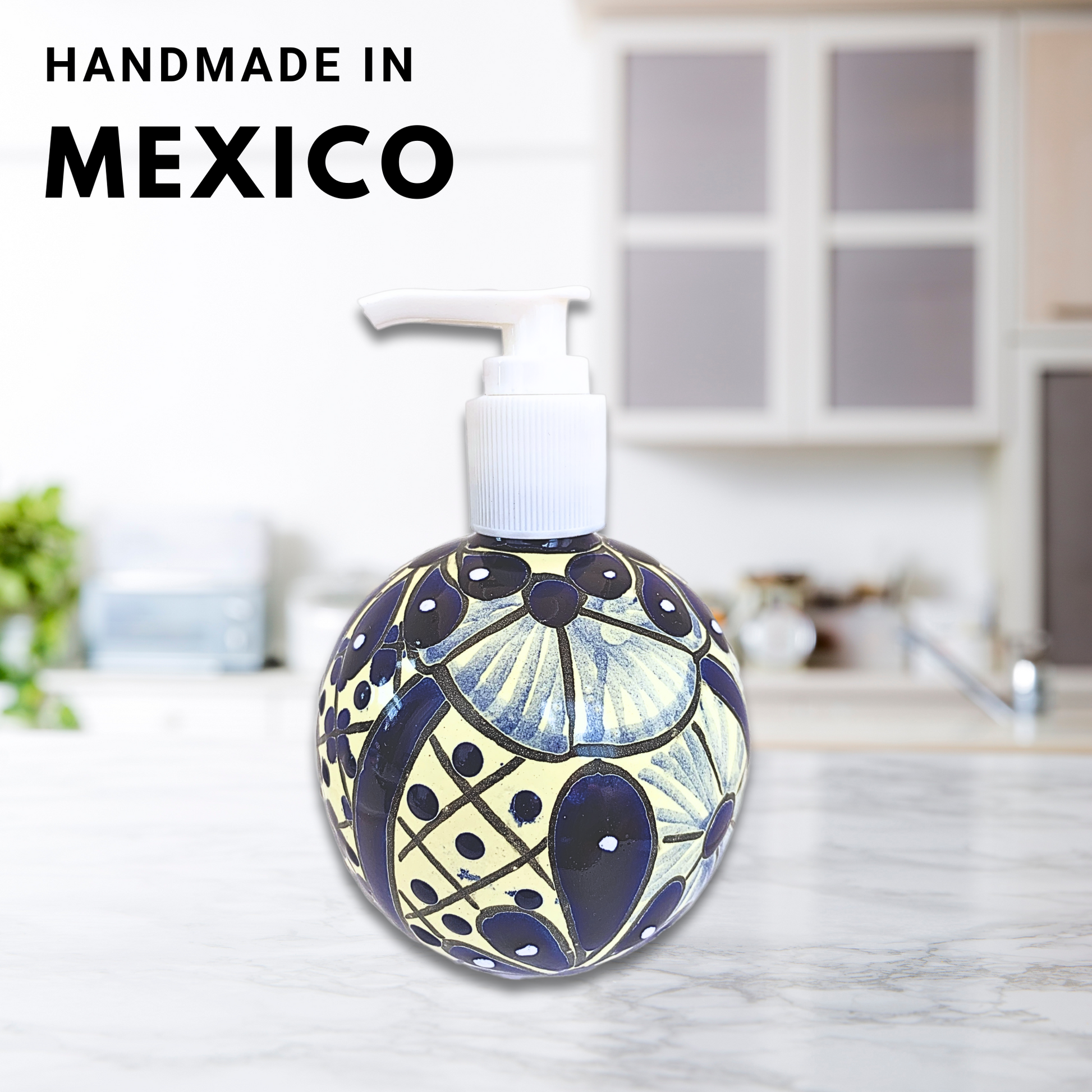 A spherical soap dispenser, hand-painted in blue and white Talavera design, adding a vibrant touch to any kitchen or bathroom.