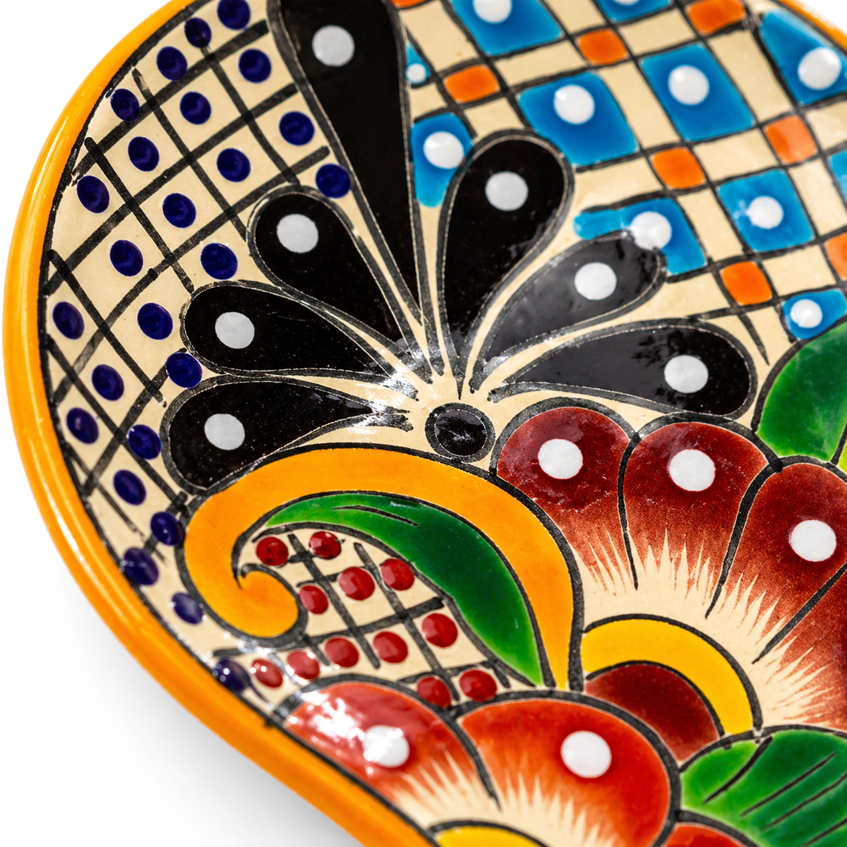 Colorful Talavera-style Mexican ceramic spoon rest, hand-painted in Mexico — top view
