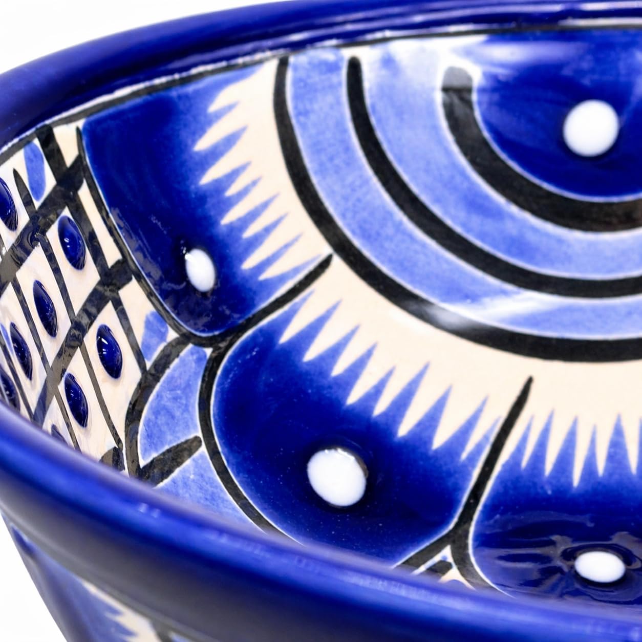 Blue and white Talavera-style ceramic salsa bowl, hand-painted in Mexico — angled view