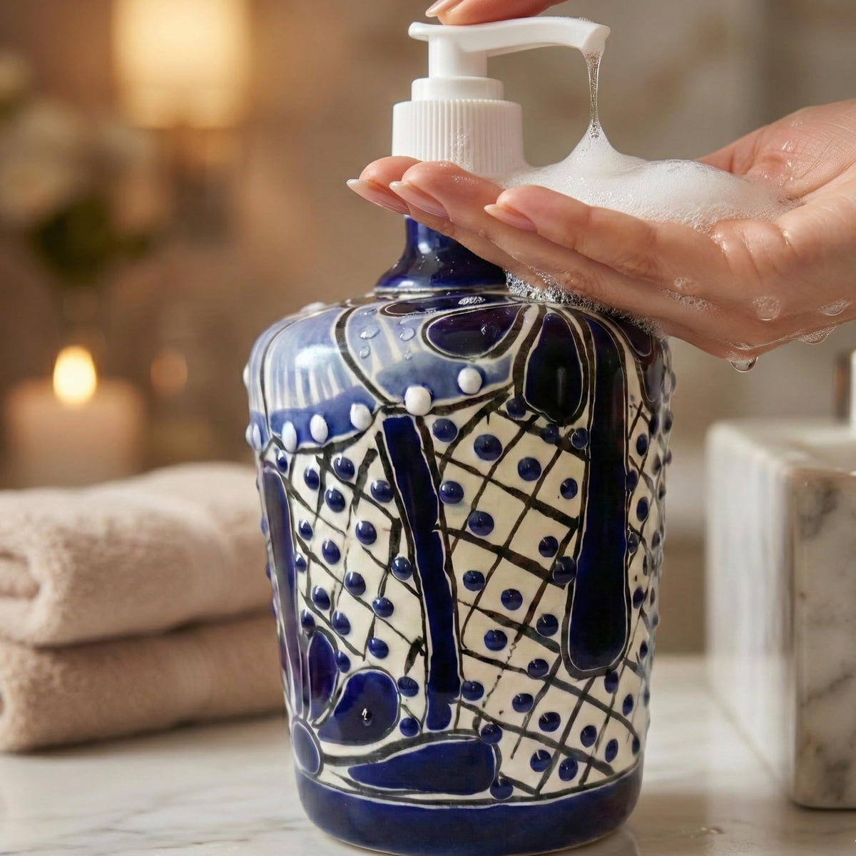 Pumping soap from the blue and white barrel dispenser