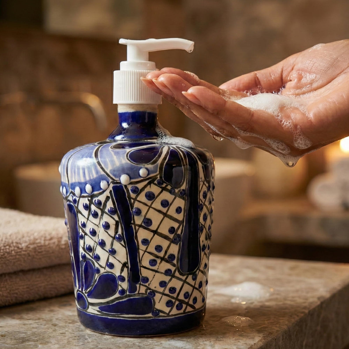 Hands using the blue and white soap dispenser
